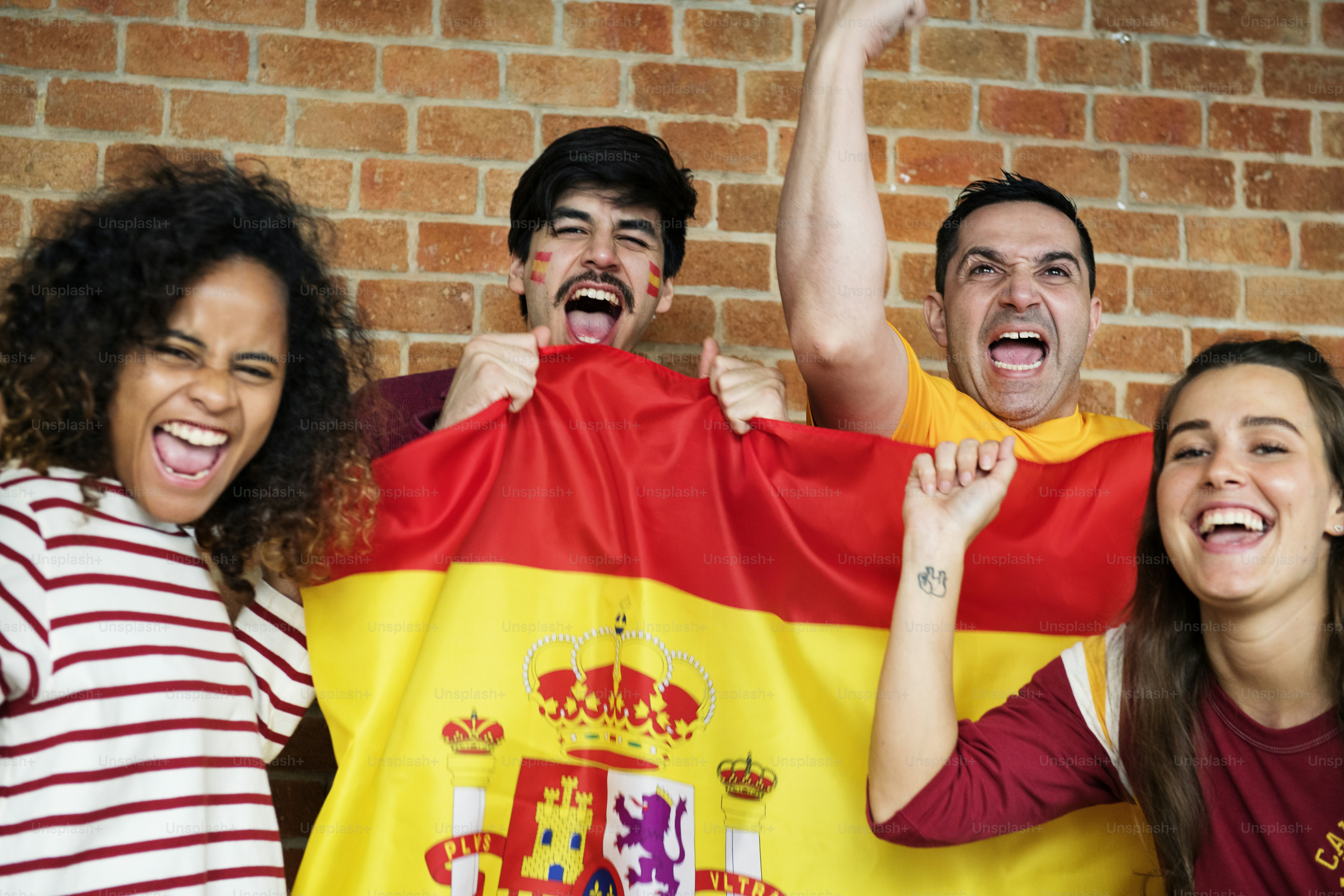 Friends cheering world cup with painted flag